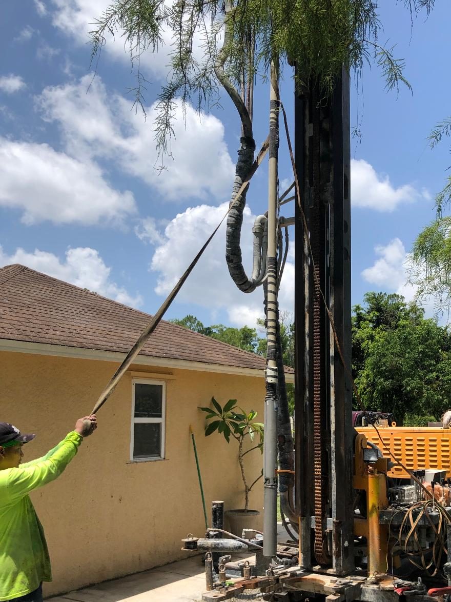 Technician operating drilling equipment